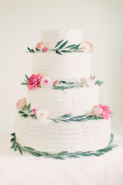 Sugarpaste leaves and flowers spun onto a rustic cake